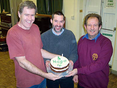 Birthday cake with four candles and fork handles